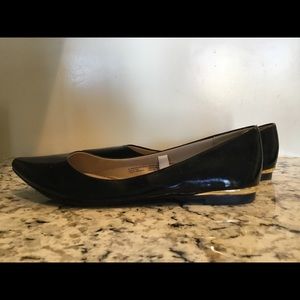 NEVER WORN Mossimo black point toe flats with gold heal accents. Size 6